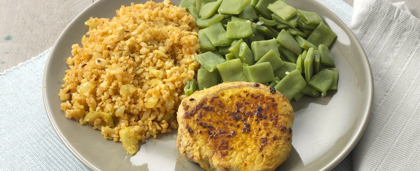 Varkensfiletlapje met bloemkoolrijst & snijbonen
