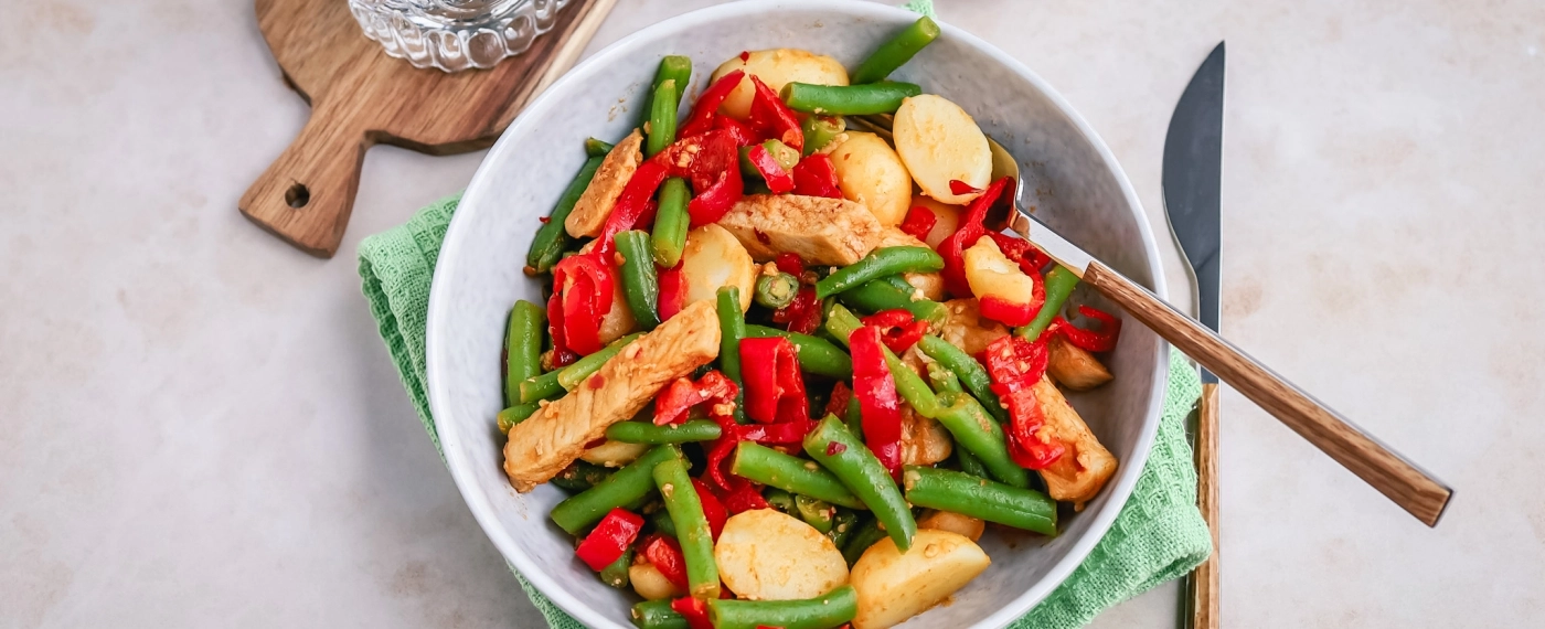 Krieltjes roerbak met varkensfiletreepjes & puntpaprika